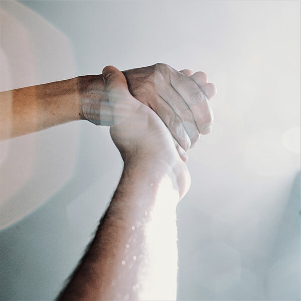 Helping hands showing guidance and support between two people. YTherapy offers mental health support and therapy for stress and burnout in London and online.